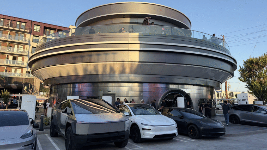 The retro-futuristic Tesla Diner facility with Tesla vehicles parked outside.