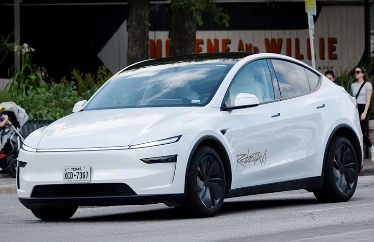 The White Model Y Tesla Robotaxi.