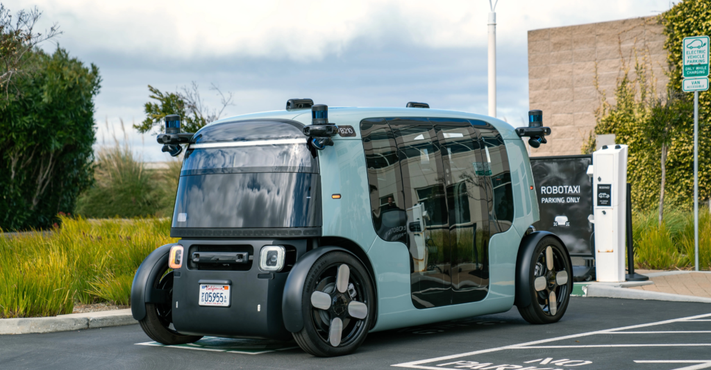 A Zoox "toaster" robotaxi at a robotaxi parking lot in San Francisco